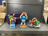 M&M CANDY DISPENSER COLLECTIBLES IN PURPLE BIN