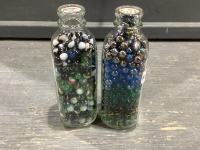 2 GLASS MILK JARS OF MARBLES & COLORED GLASS BALLS