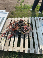 Pallet of booster cables with alligator clips