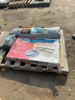 Pallet with hitch, mounted cargo carrier, a tent, and a curtain