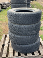 Stack of 4 light truck tires