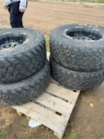Set of four heavy truck tires on rims