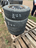 Four car tires on rims