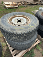 Three light truck tires on steel rims