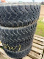 Stack of four Hankook tires on six bolt rims GM