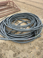 Assorted length and sizes of black poly pipe