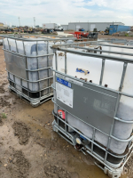 Two tubs of red rubber mulch
