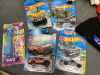 SMALL BOX OF SPORTS MEMORBILIA AND NEW HOT WHEELS CARS - 3