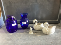 BOX W/ 2 CERAMIC SWANS, BLUE VASE, BLUE JAR , SMALL FIGURINE