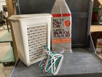 (2) ITEMS- TABLE TOP IRONING BOARD, LAUNDRY HAMPER W/HANGERS