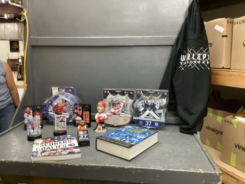 BOX OF HOCKEY COLLECTIBLES - TIM HORTONS MINI STICKS, PAUL ANDERSON, HOLTE,AND HELLEBUYCK FIGURINES, MINI HOCKEY STICKS