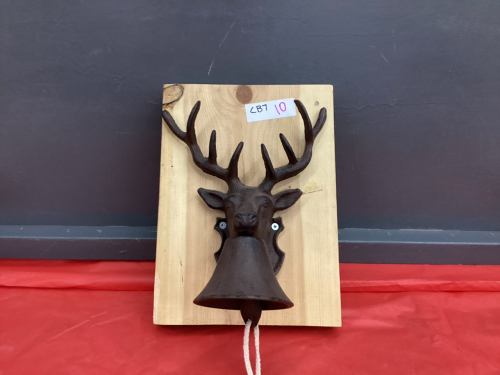 CAST DEER HEAD W/ BELL MOUNTED ON WOOD SLAB