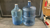 2 PLASTIC WATER JUGS