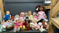 LARGE BOX OF DOLLS AND SOME WRAPPING PAPER
