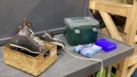 BASKET W/HOCKEY SKATES + A SMALL STANLEY COOLER WITH COLD PACKS