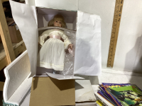 BOX WITH PORCELAIN DOLL, COLLECTOR PLATE AND LEGO BOOKS