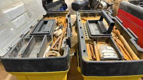 Two. Toolboxes with contents.