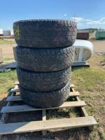 Stack of four Cooper tires