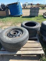 Pallet of four mixed tires some on rims