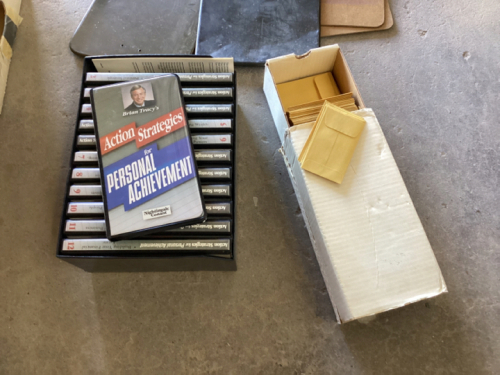 OLD OFFICE CLIPBOARDS AND SELF HELP CASSETTES