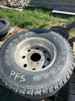 Two truck tires on aluminum rims