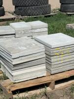 Two stacks of concrete patio blocks
