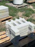 Stack of concrete garden fence edge