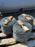 Three rolls of new barbed wire