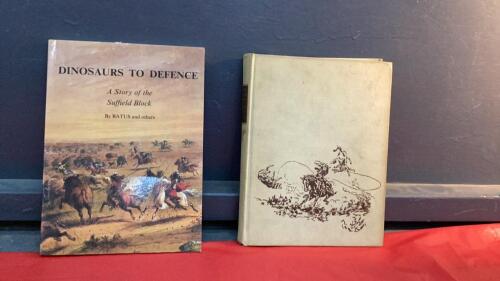 (2) HISTORY BOOKS - "DINOSAURS TO DEFENCE" STORY OF THE SUFFIELD BLOCK AND "TRAILS PLOUGHED UNDER" BY CHARLES M. RUSSELL