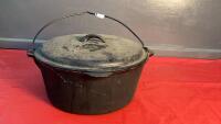 CAST IRON DUTCH OVEN W/ LID & HANDLE - LID IS MARKED TEXSPORT