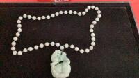 LIGHT GREEN STONE NECKLACE W/ LION DESIGN