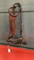BROWN LEATHER HEADSTALL W/ FLY FRINGE ON BROWBAND AND BLACK NOSEBAND