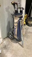 GOLF BAG W/ CLUBS AND PUSH CART WITH A WOOD BAT