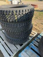 Stack of four Toyota light truck tires