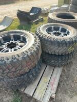 Set of four light truck tires on aluminum rims