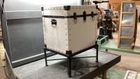 VINYL COVERED TRUNK ON A METAL STAND