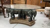 ROUND GLASS TOPPED COFFEE TABLE W/ ELEPHANT PEDESTAL BASE