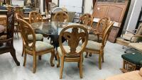LARGE ROUND PEDESTAL TABLE W/ GLASS TOP & ELEPHANT HEAD BASE AND (8) CHAIRS