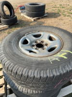 Three Toyo tires on rims