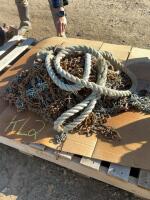 Pallet of mixed tire chains and tow rope