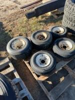 Five lawnmower tires on rims