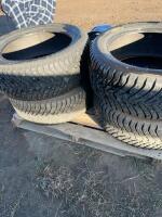Stack of four studded tires