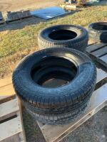 Stack of four Goodyear tires