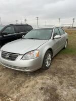 2004 NISSAN ALTIMA ( MANITOBA REGISTERED ) - Includes (4) winter tires on rims and (4) summer tires (not on rims)