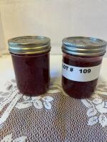 Two jars of homemade raspberry jam