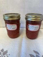 Two jars of crab apple sauce