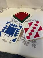Three mug rugs