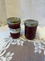 Two jars regular raspberry jam