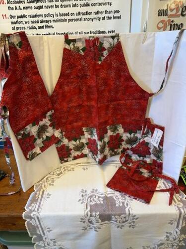 Mother and two daughters Christmas aprons