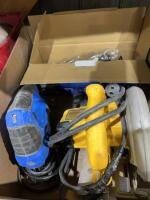 Box of saws and welding gear